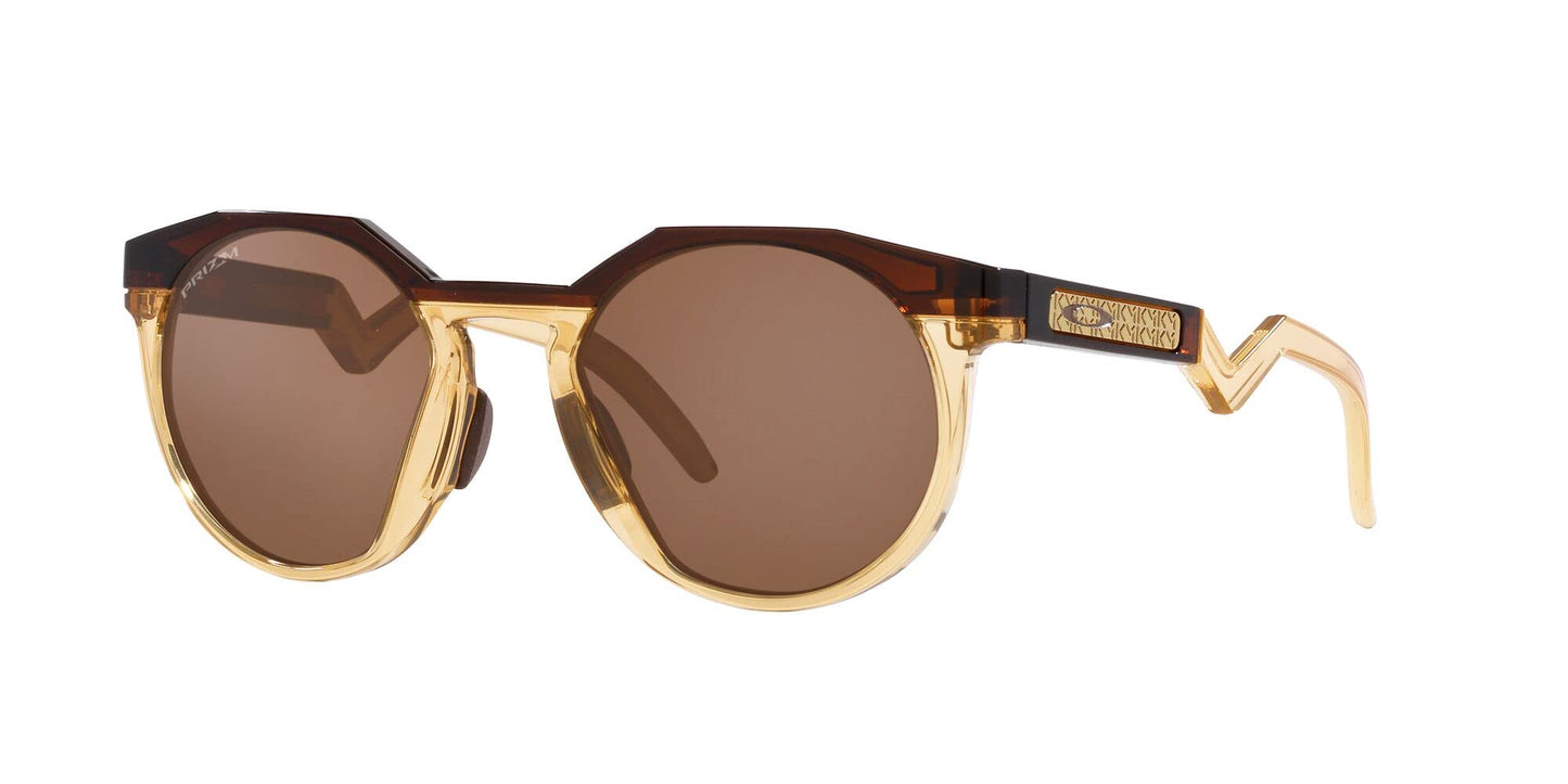 Oakley Men's OO9242A HSTN Low Bridge Fit Round Sunglasses, Kylian Mbappe Dark Amber/Light Curry/Prizm Tungsten, 52 mm