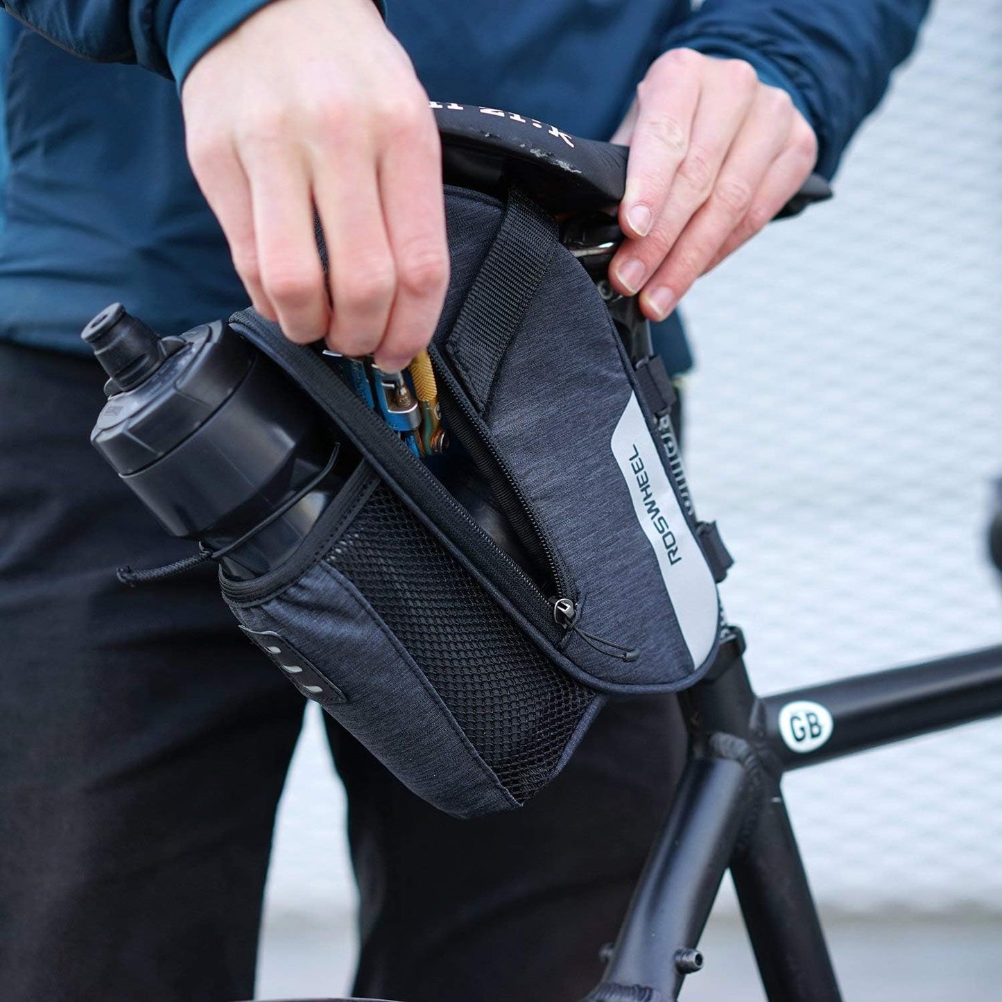 Roswheel Essentials Series 131464 Water Resistant Bike Saddle Bag Bicycle Under Seat Pack Cycling Accessories Pouch with Water Bottle Holder