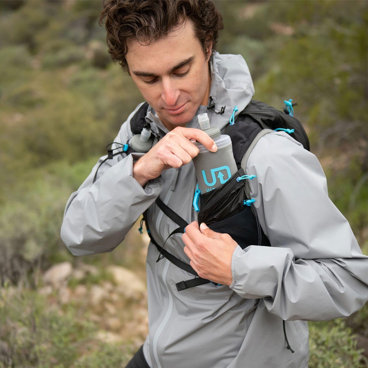 Ultimate Direction Adventure Vest Men's Hydration and Endurance Running Vest, 2L Hydration Bladder Compatible, Upgraded Fit and Finishes, Trekking Pole Loops, GPS Locator Pocket, 2023 (Onyx, Small)
